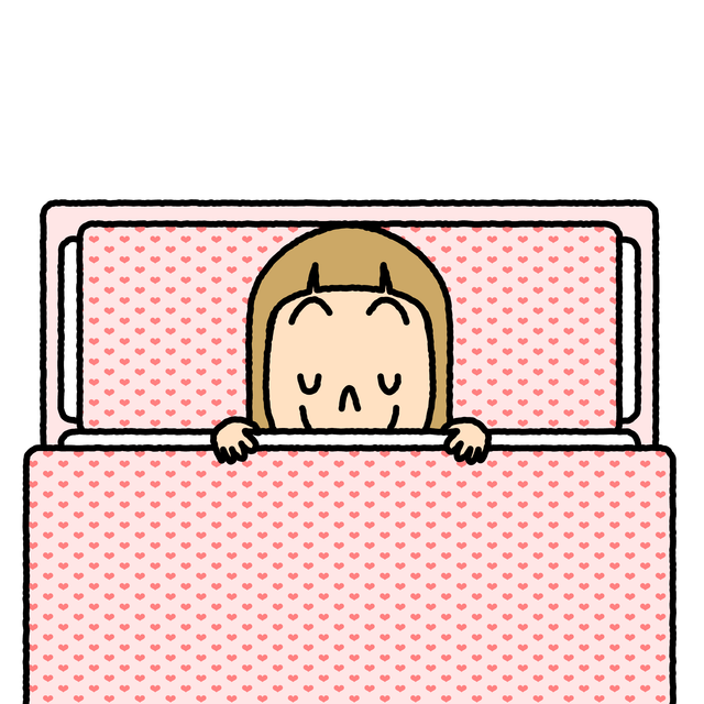 ピンクの掛け布団から顔をのぞかせるヴィクトワールちゃん